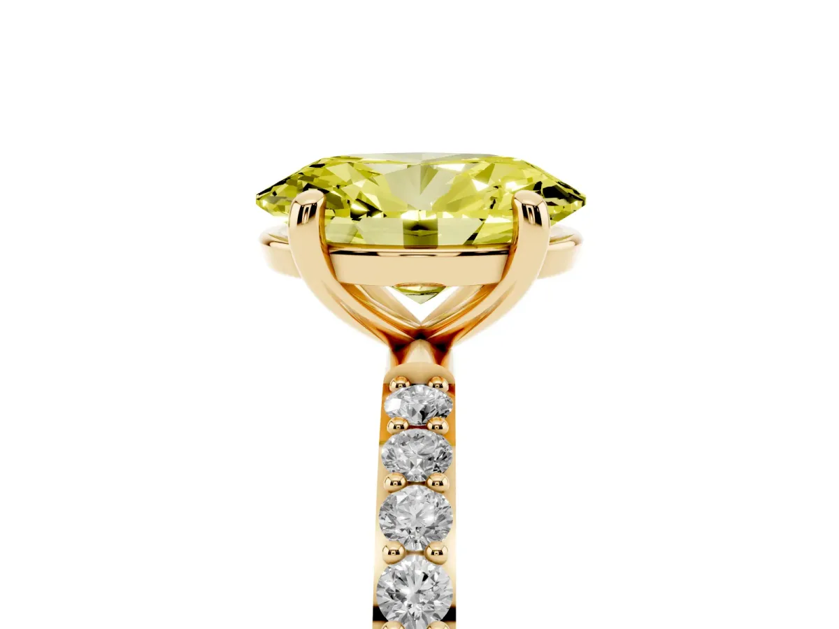 Fancy Yellow Oval Cut Diamond Solitaire Ring with Round Pavé Band and Prong Setting Yellow gold