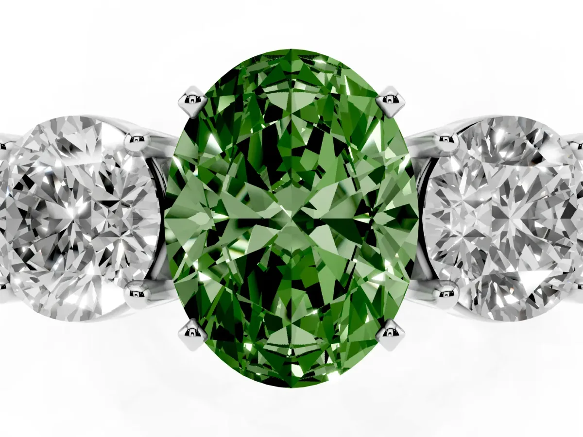 Fancy Green Three-Stone Oval Cut Diamond Ring with Round Side Stones, Classic Band, and Four-Prong Setting Silver