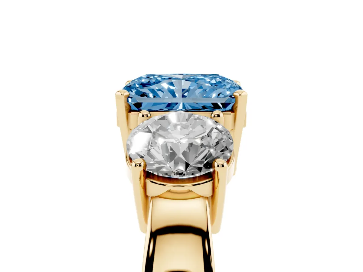 Fancy Blue Three-Stone Radiant Cut Diamond Ring with Round Side Stones, Classic Band, and Four-Prong Setting Yellow gold
