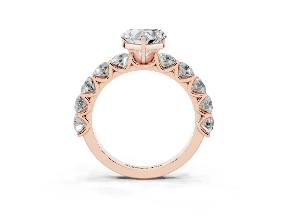 Heart Cut Diamond Prong Setting with Side Stones on a Pave Band Rose gold
