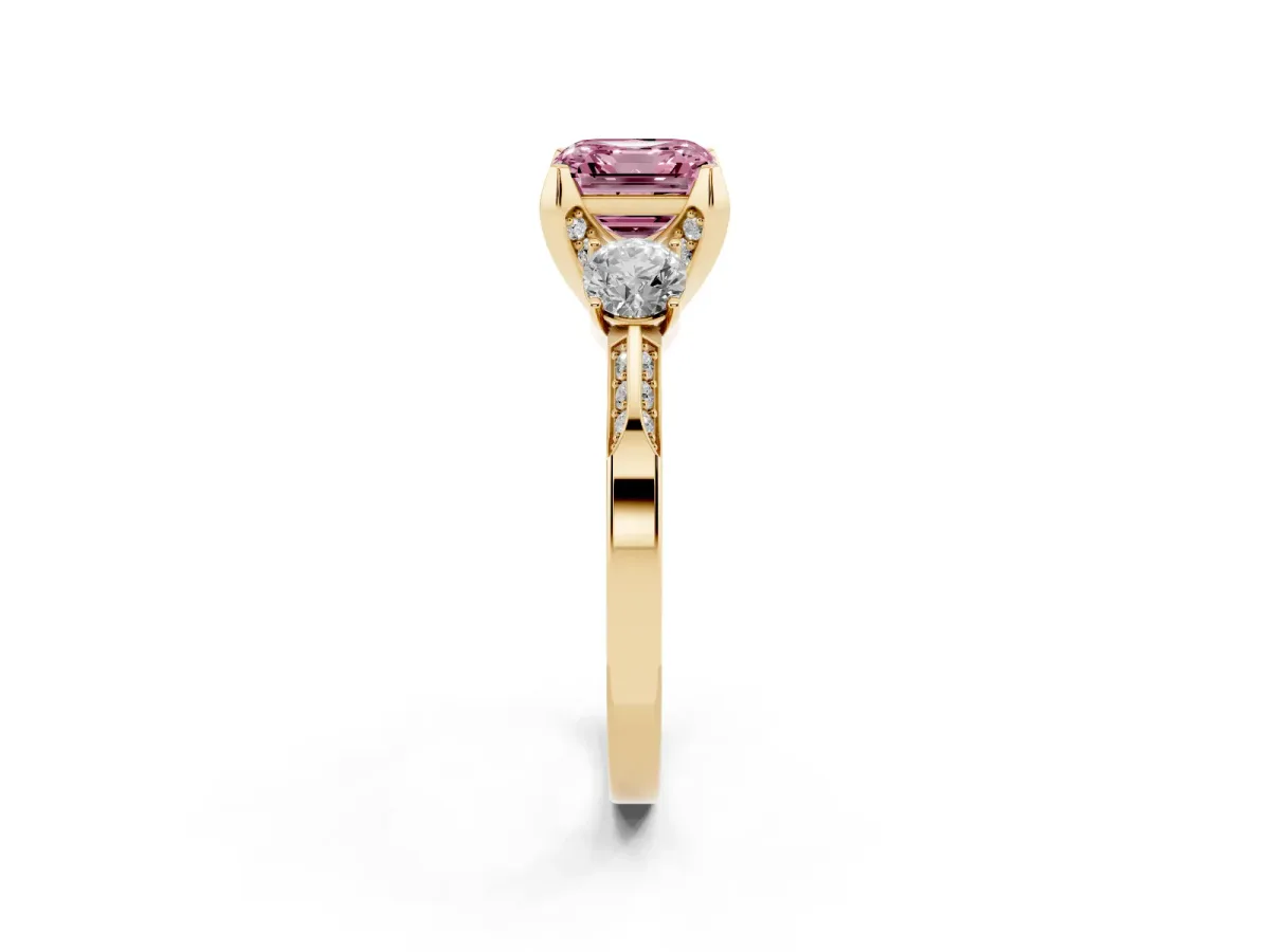 Fancy Pink Asscher Cut Brilliant Three-Stone Diamond Ring with Pavé Band and Four-Prong Setting Yellow gold