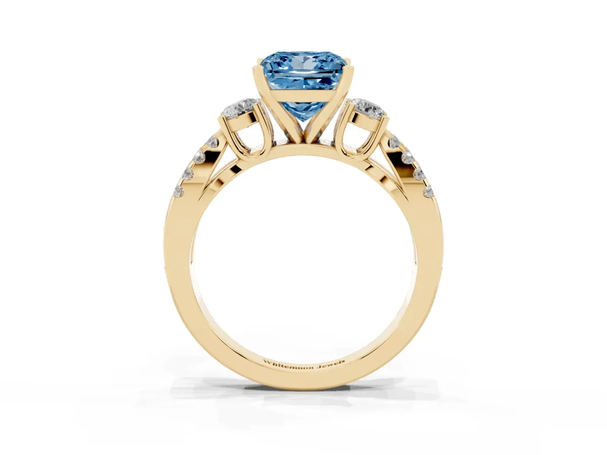 Fancy Blue Princess Cut Diamond Three-Stone Ring with Pavé Split Shank and Four-Prong Setting Yellow gold