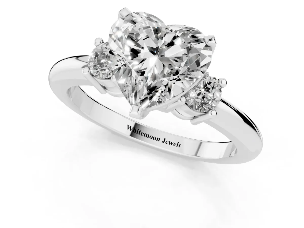 Three-Stone Heart Cut Cut Diamond Solitaire with Prong Setting and Classic Band Silver