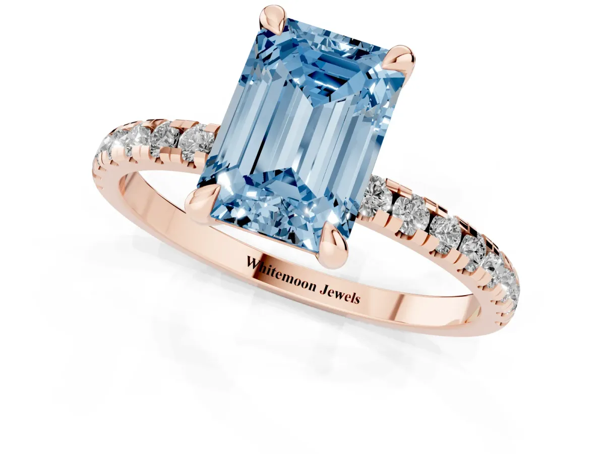 Fancy Blue Emerald Cut Diamond Brilliant Solitaire Ring with Pavé Band and Four-Prong Setting Rose gold