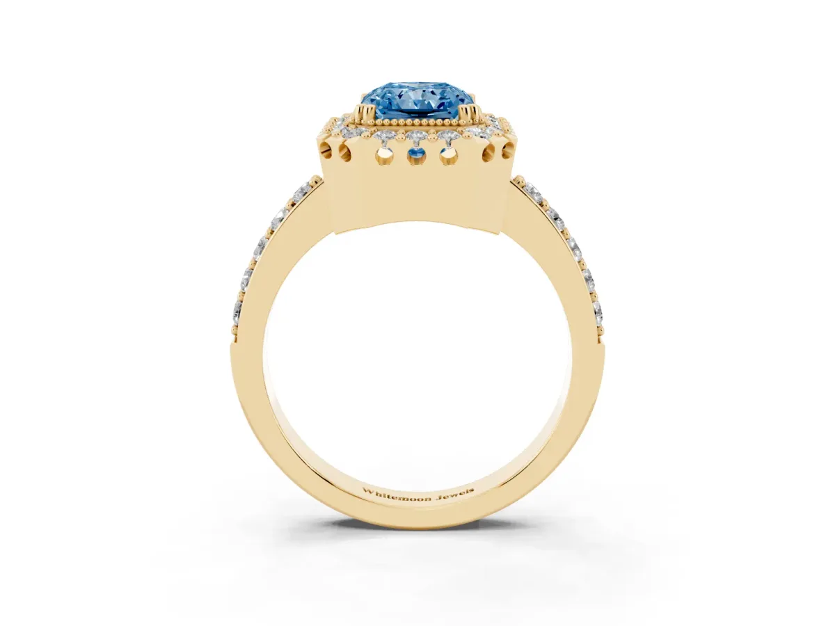 Fancy Blue Radiant Cut Diamond Halo Ring with Pavé Band and Prong Setting Yellow gold
