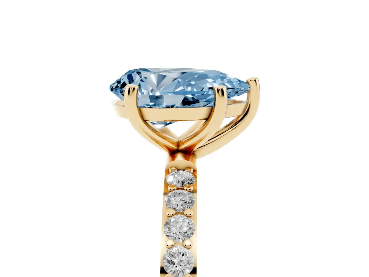 Fancy Blue Pear Cut Diamond Solitaire Ring with Round Pavé Shoulders and Prong Setting Yellow gold