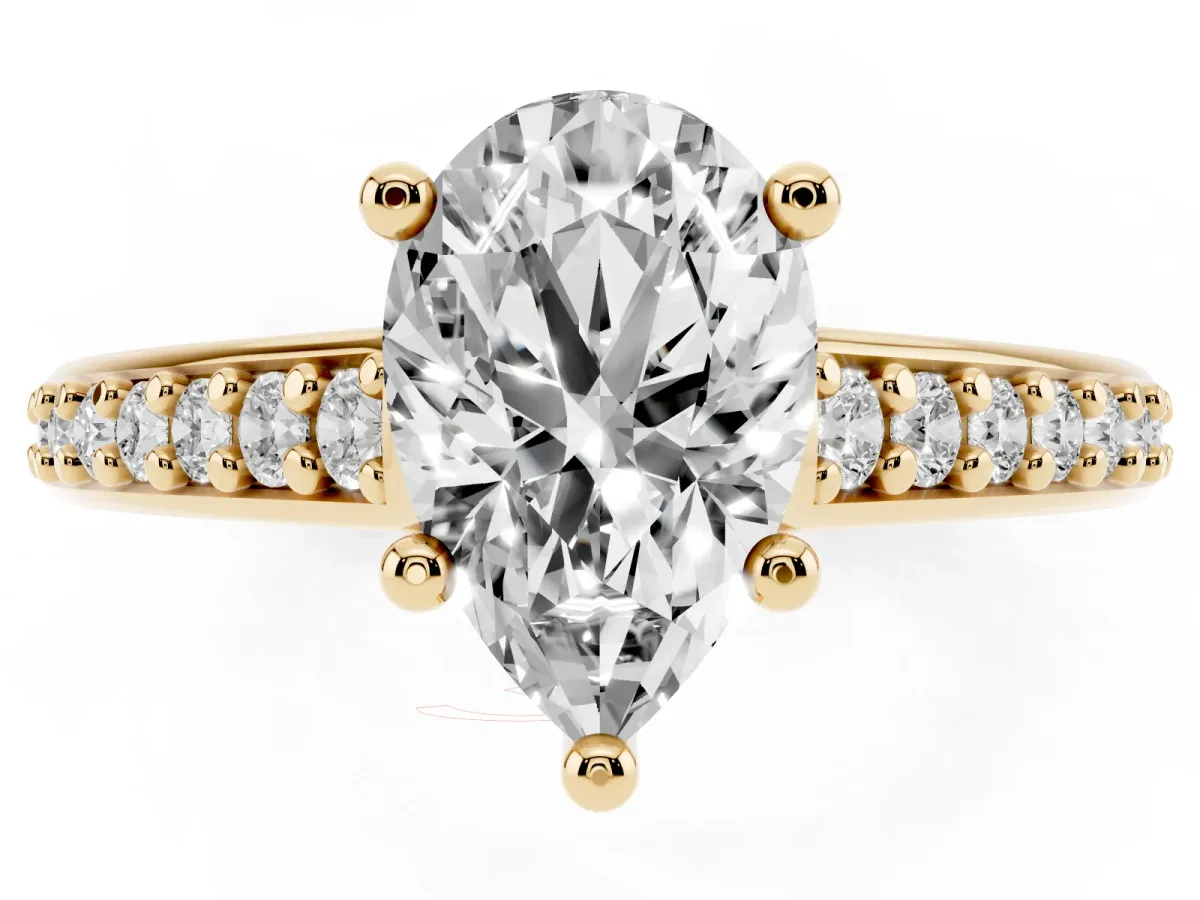 Pear Cut Solitaire Prong Set Diamond Engagement Ring with Pave Band Yellow gold