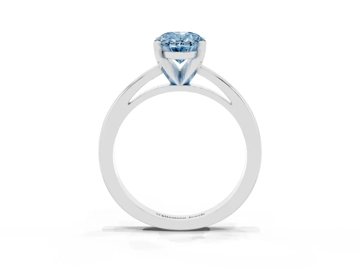 Fancy Blue Oval Cut Solitaire Diamond Engagement Ring with Four-Prong Setting on a Classic Band Silver