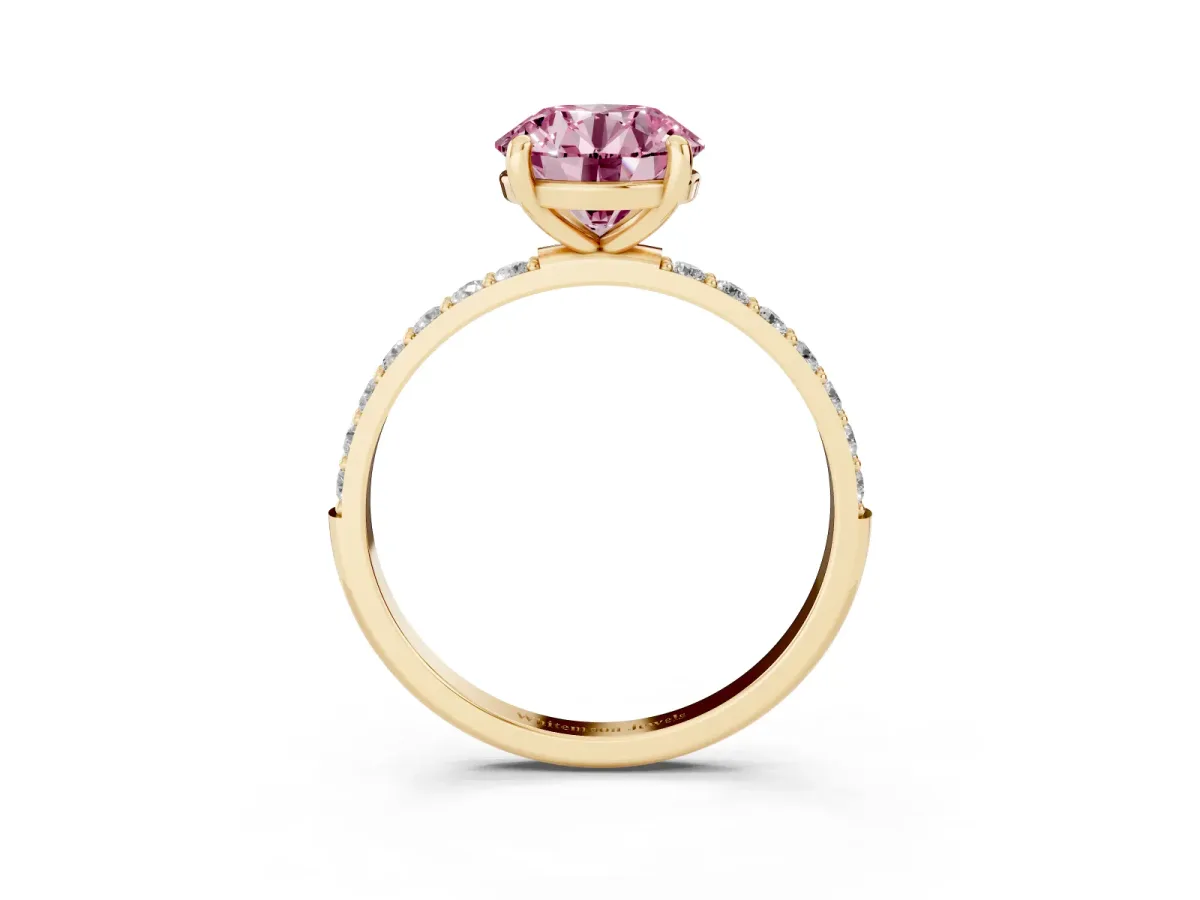 Fancy Pink Round Cut Diamond Solitaire Ring with Round Pavé Band and Prong Setting Yellow gold