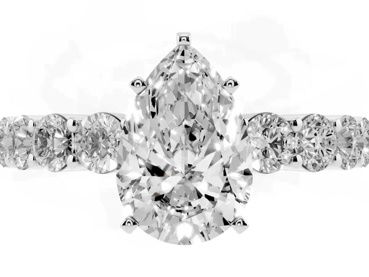 Pear Cut Diamond Solitaire Ring with Shared Prong Round Side Stones White gold