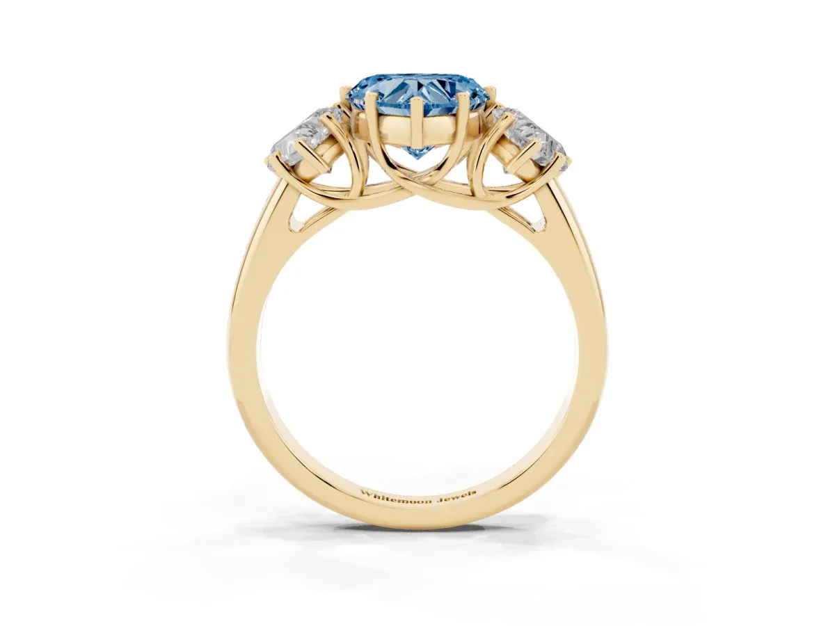 Fancy Blue Three-Stone Heart Cut Diamond Engagement Ring with Prong Setting Yellow gold