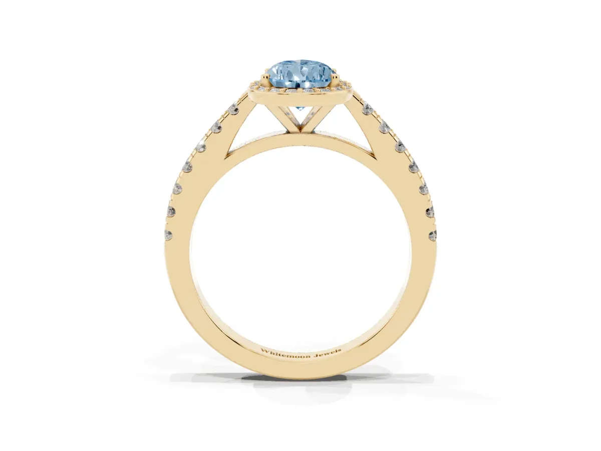 Fancy Blue Pear Cut Cut Halo Diamond Engagement Ring with Pave Band and Four-Prong Setting Yellow gold