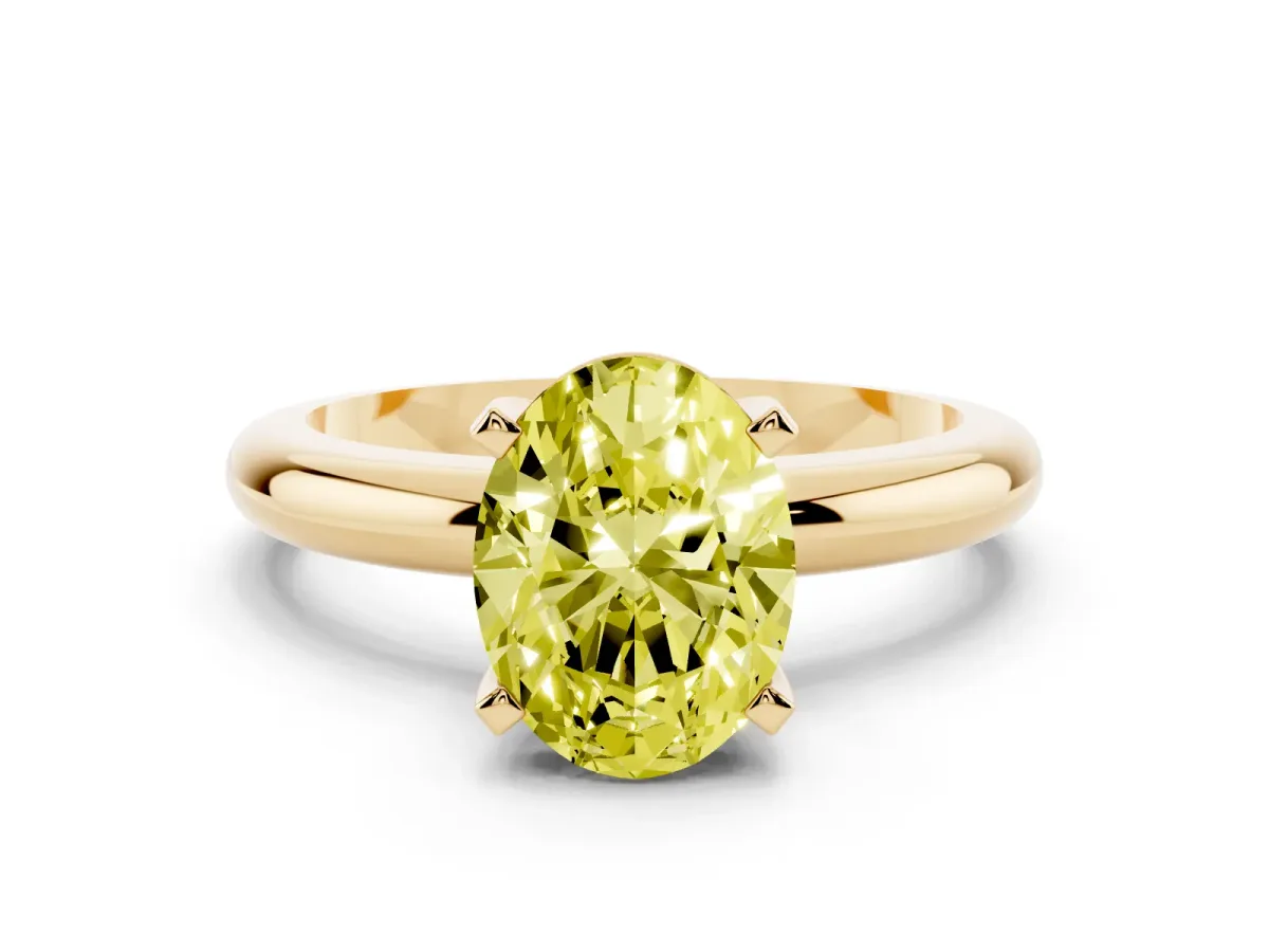 Fancy Yellow Oval Cut Diamond Solitaire Engagement Ring with Round Band and Four-Prong Setting Yellow gold