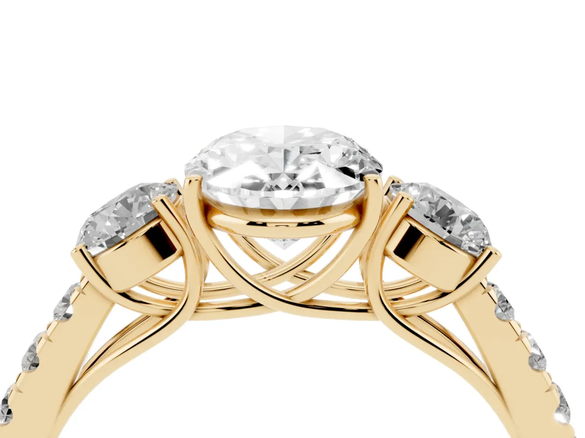 Oval Cut Cut Diamond Three-Stone Ring with Round Side Stones and Pavé Band Yellow gold