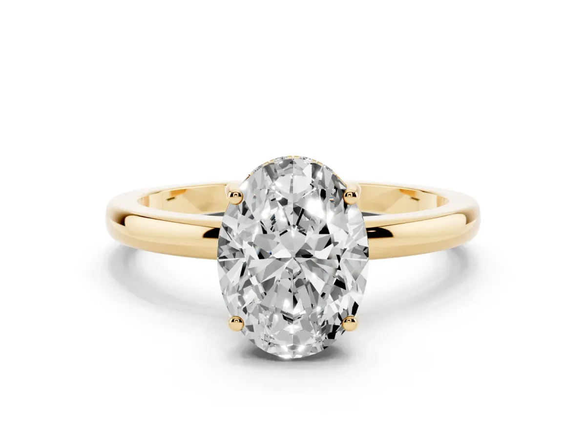 Oval Cut Solitaire Diamond Ring with Prong Setting and Plain Band Yellow gold