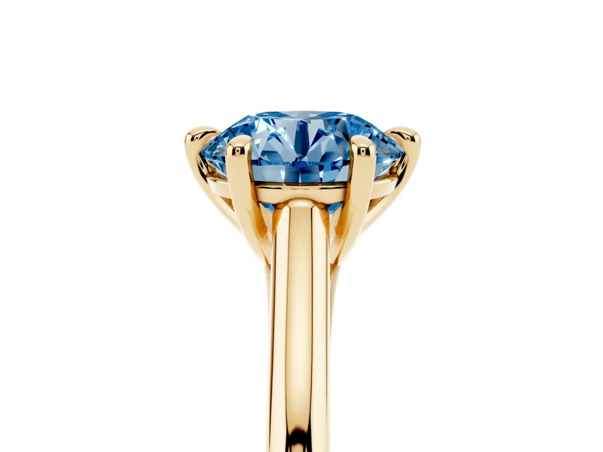 Fancy Blue Round Cut Solitaire Engagement Ring with Six-Prong Setting and Classic Band Yellow gold