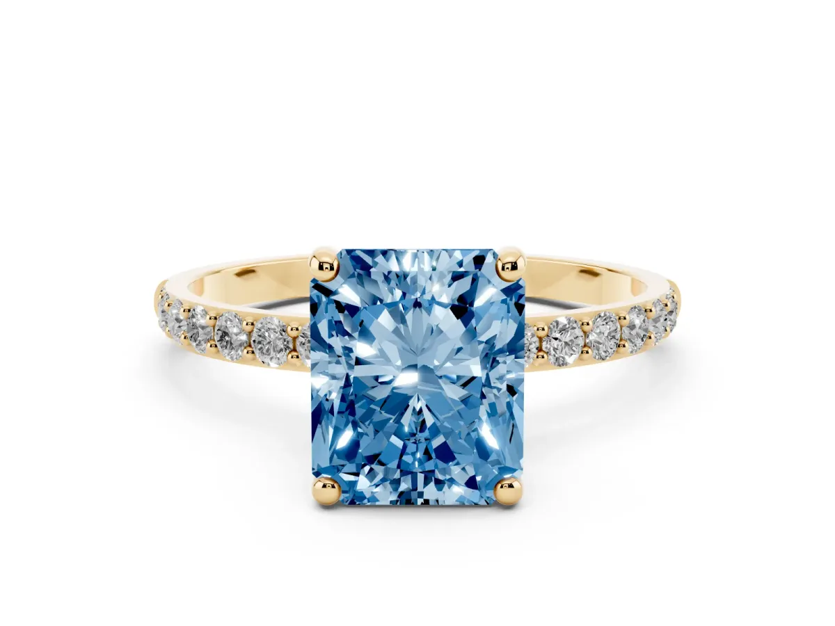 Fancy Blue Radiant Cut Diamond Solitaire Ring with Round Pavé Band and Prong Setting Yellow gold