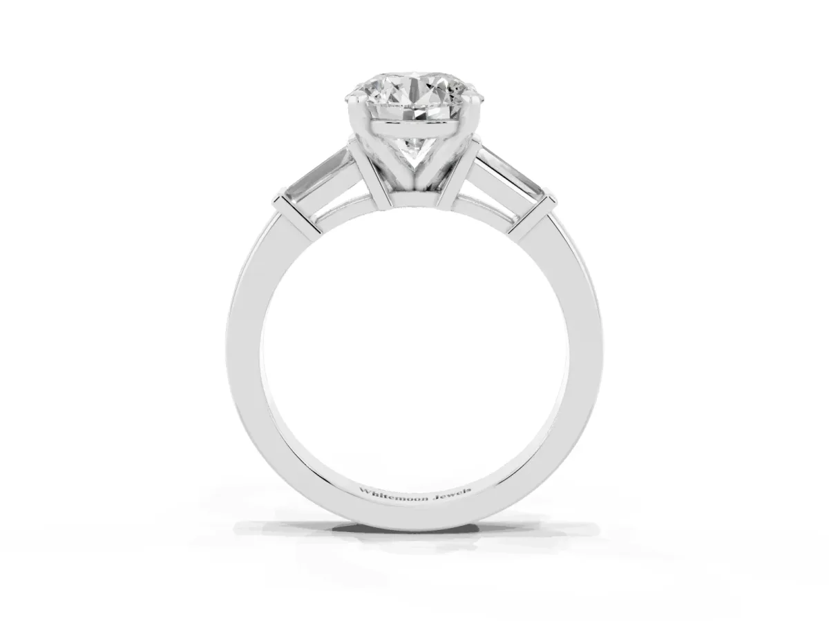 Round Cut Cut Diamond Solitaire Ring with Tapered Baguette Accents and Four-Prong Setting White gold