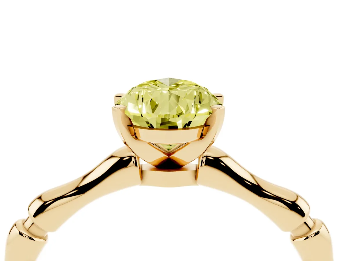Fancy Yellow Pear Cut Solitaire Diamond Ring with Bamboo Band and Four-Prong Setting Yellow gold