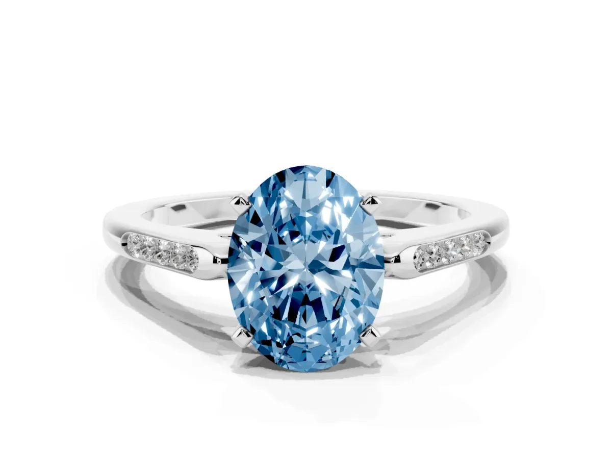 Fancy Blue Oval Cut Diamond Solitaire Ring with Channel Set Round Band and Prong Setting Silver