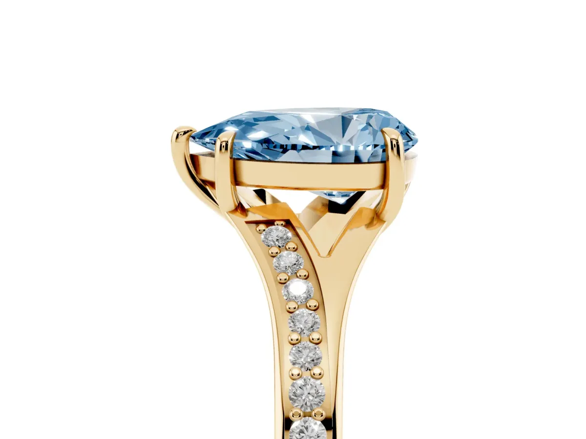 Fancy Blue Pear Cut Diamond Solitaire Ring with Pavé Band and Prong Setting Yellow gold