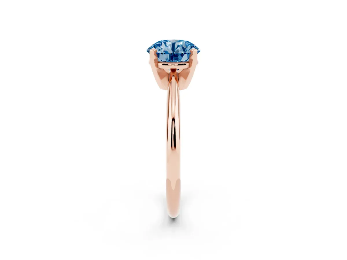 Fancy Blue Round Cut Cut Solitaire Ring with Four-Prong Setting on a Classic Band Rose gold