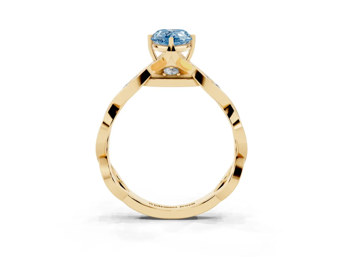 Fancy Blue Pear Cut Solitaire Twist Band with Leaf Prong Setting Yellow gold