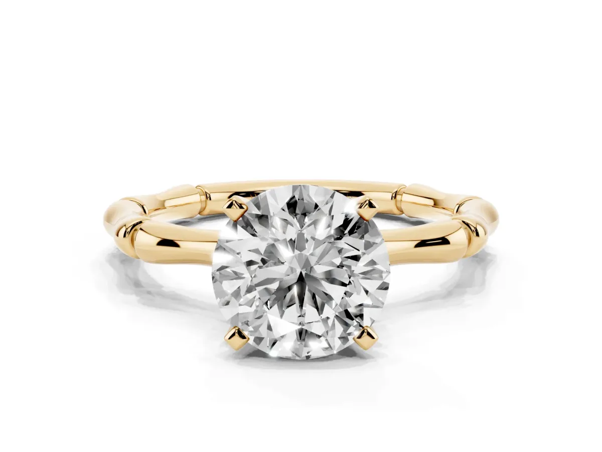 Round Cut Solitaire Diamond Ring with Bamboo Band and Four-Prong Setting Yellow gold