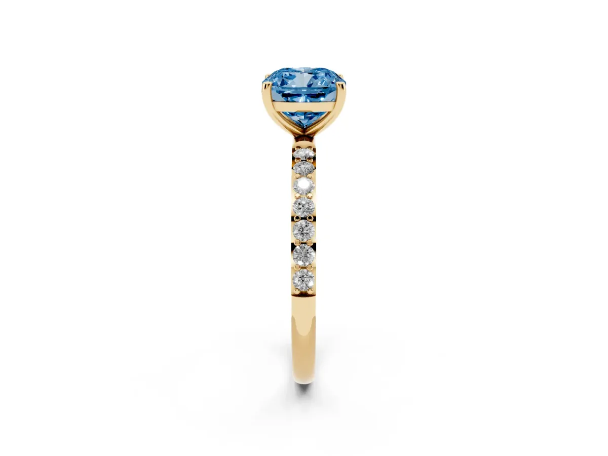 Fancy Blue Cushion Cut Diamond Solitaire Ring with Round Pavé Shoulders and Prong Setting Yellow gold