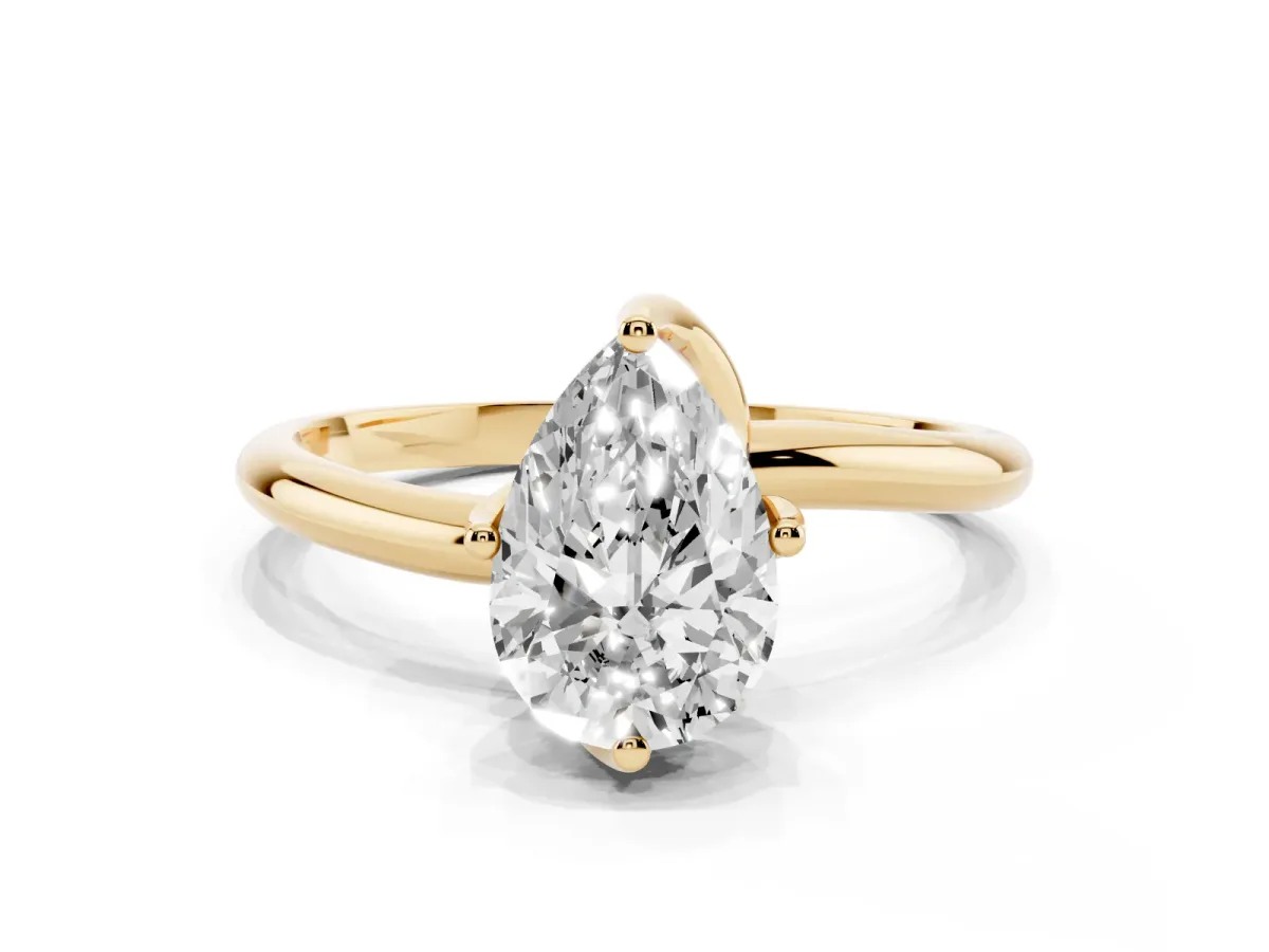 Pear Cut Diamond Solitaire Engagement Ring with Four-Prong Setting and Classic Band Yellow gold