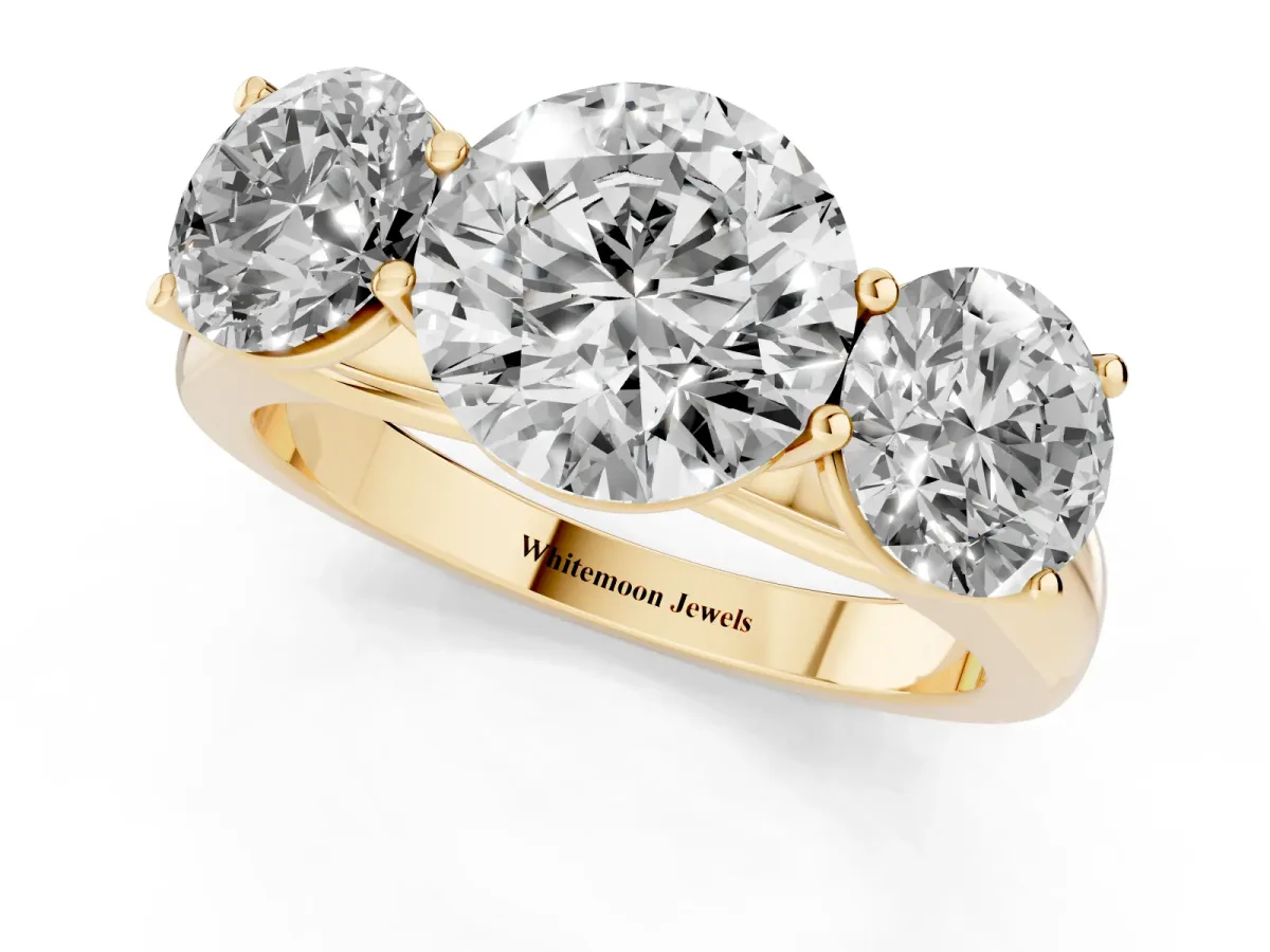 Round Cut Three-Stone Diamond Ring with Prong Setting on a Classic Band Yellow gold