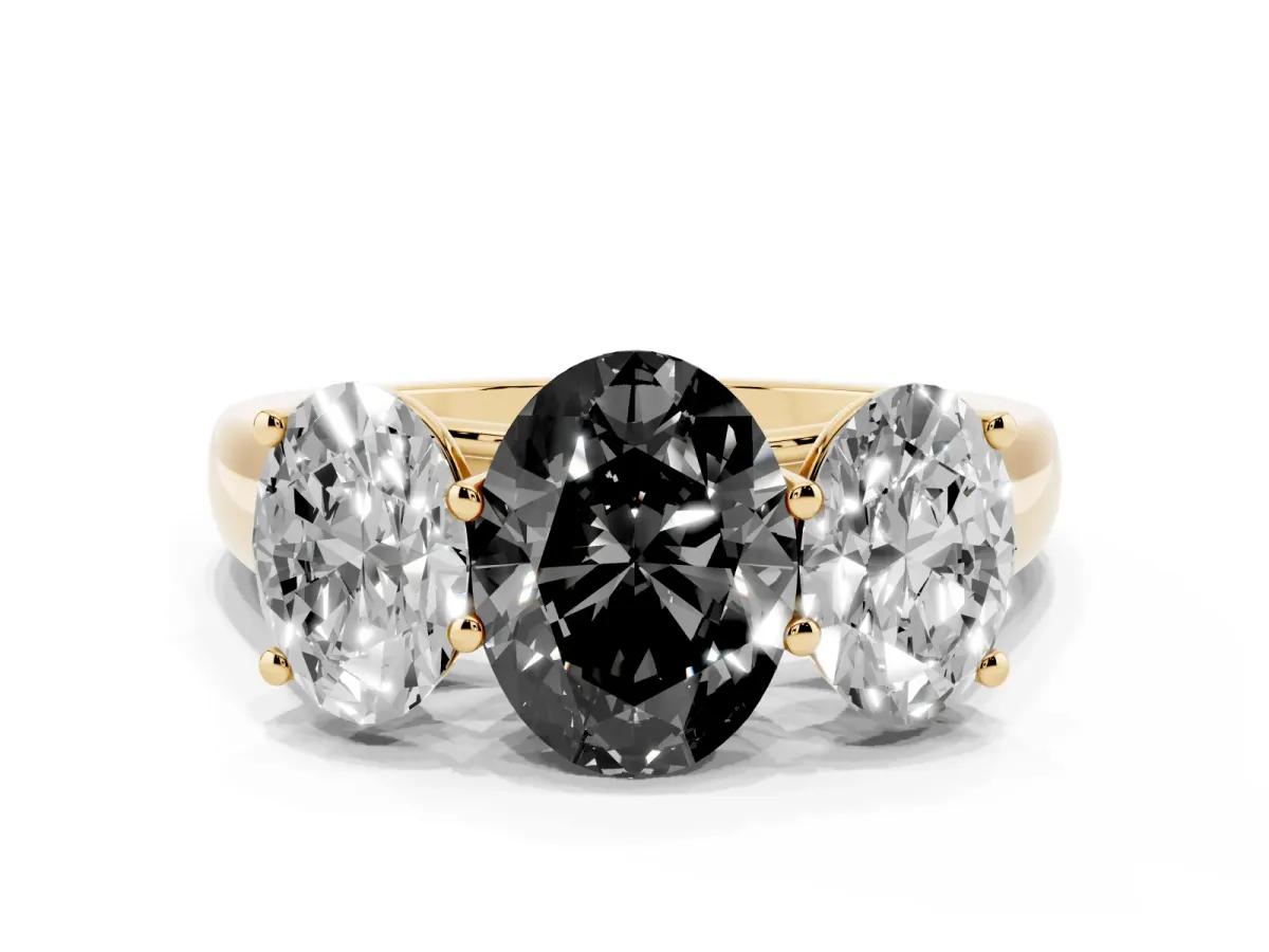 Fancy Black Oval Cut Three-Stone Diamond Ring with Prong Setting on a Classic Band Yellow gold