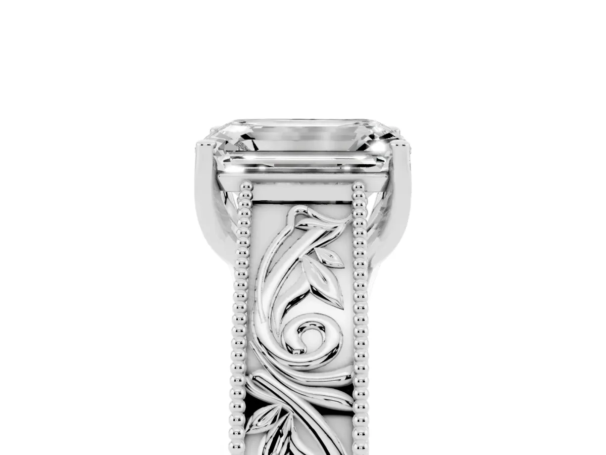 Emerald Cut Diamond Solitaire Ring with Engraved Band and Four-Prong Setting Platinum