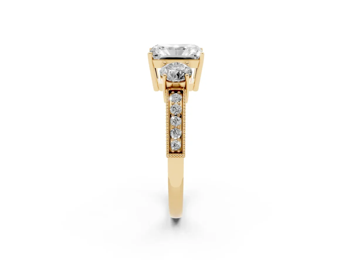 Radiant Cut Three-Stone Diamond Ring with Pavé Band and Four-Prong Setting Yellow gold