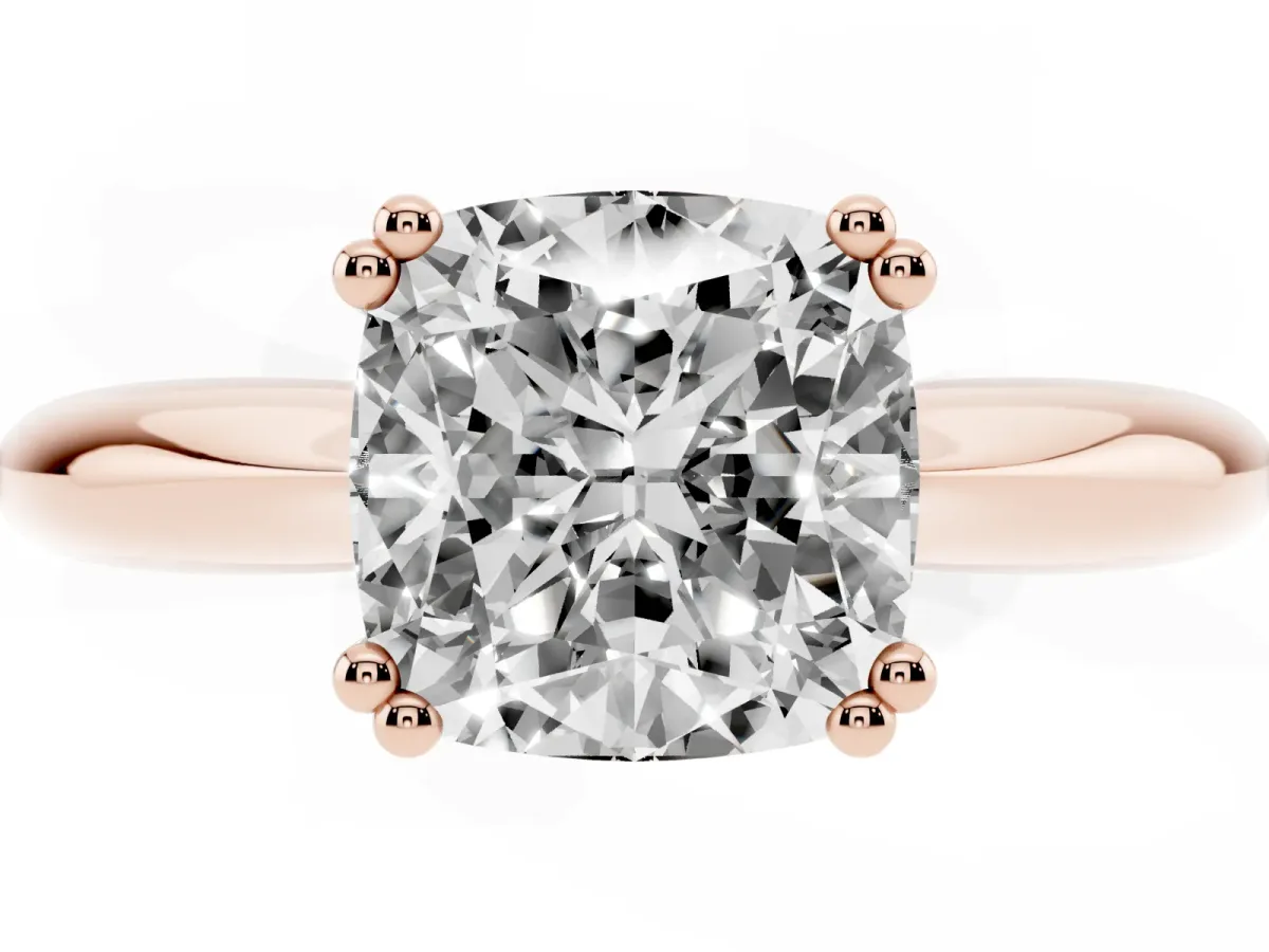 Cushion Cut Cut Solitaire Engagement Ring with Tapered Band and Four-Prong Setting Rose gold