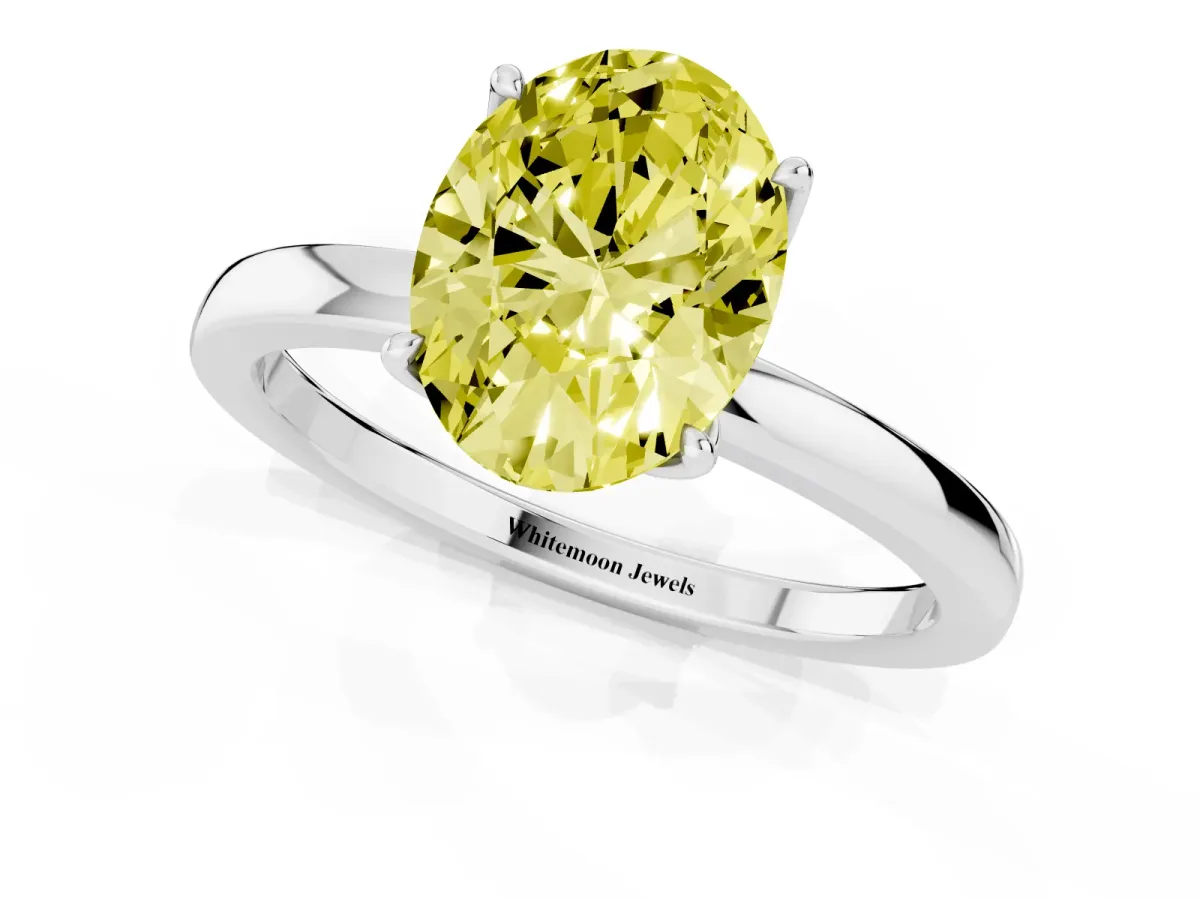 Fancy Yellow Oval Cut Diamond Solitaire Ring with Thin Band and Prong Setting Silver