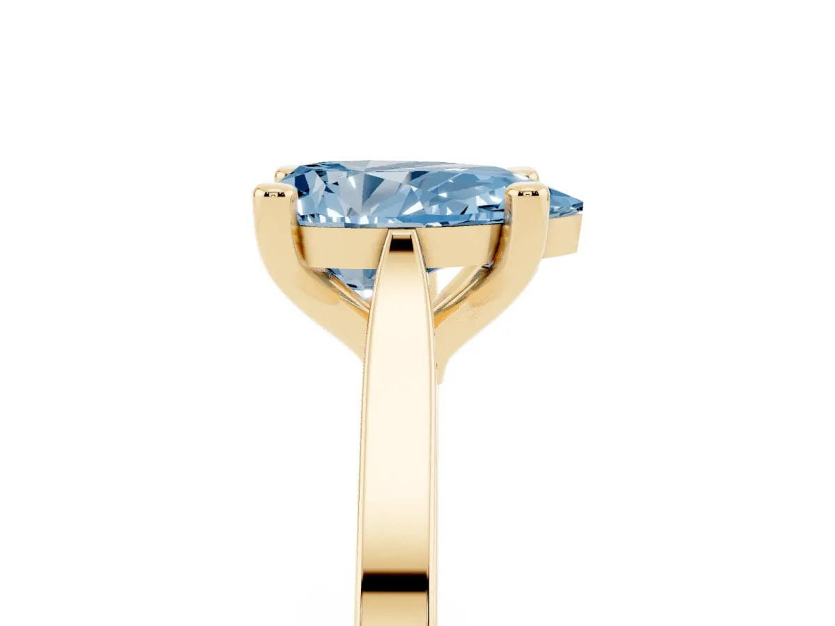 Fancy Blue Pear Cut Solitaire Diamond Ring with Four-Prong Setting and Tapered Band Yellow gold