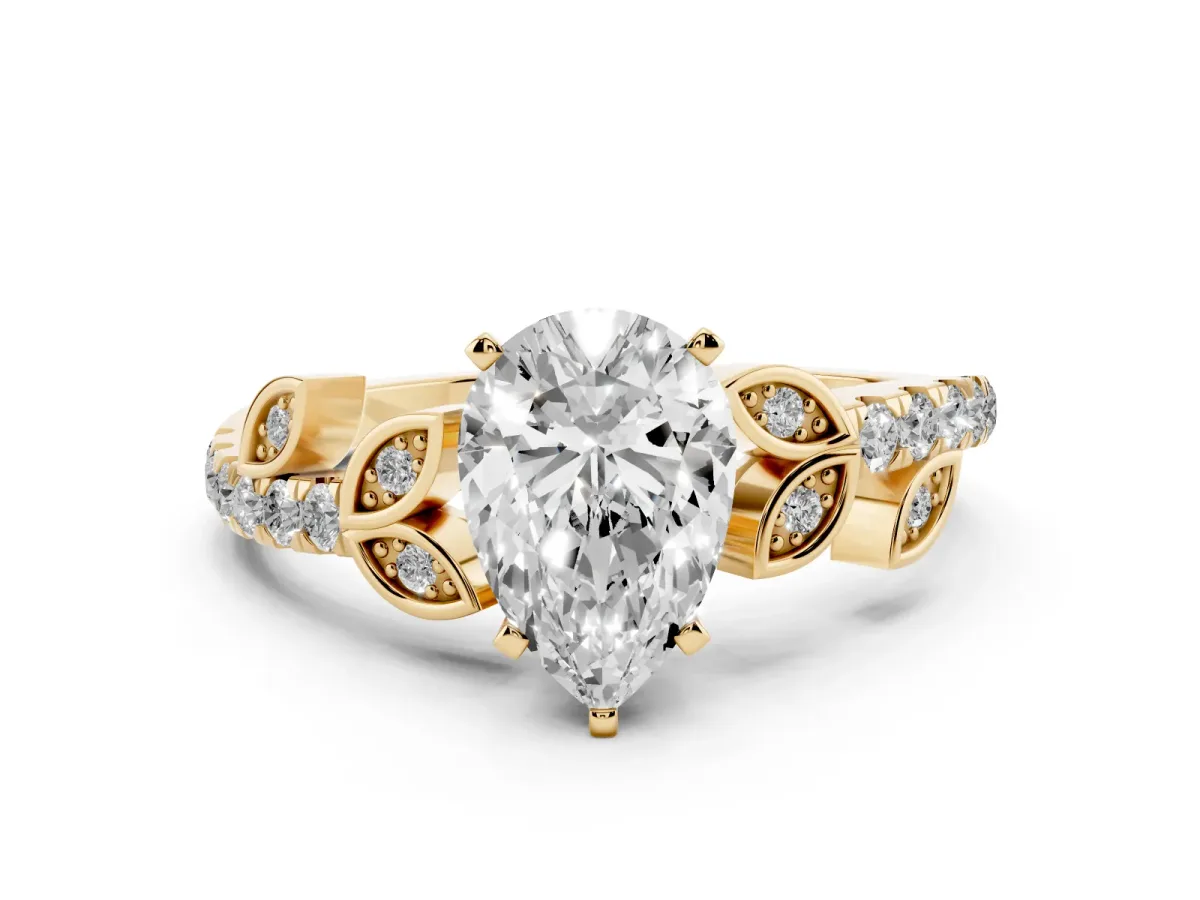 Pear Cut Solitaire Leaf-Inspired Diamond Ring with Pavé Band and Four-Prong Setting Yellow gold