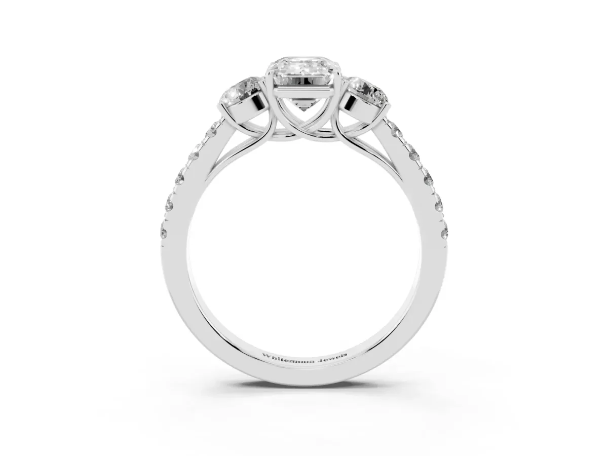 Emerald Cut Cut Diamond Three-Stone Ring with Round Side Stones and Pavé Band Platinum