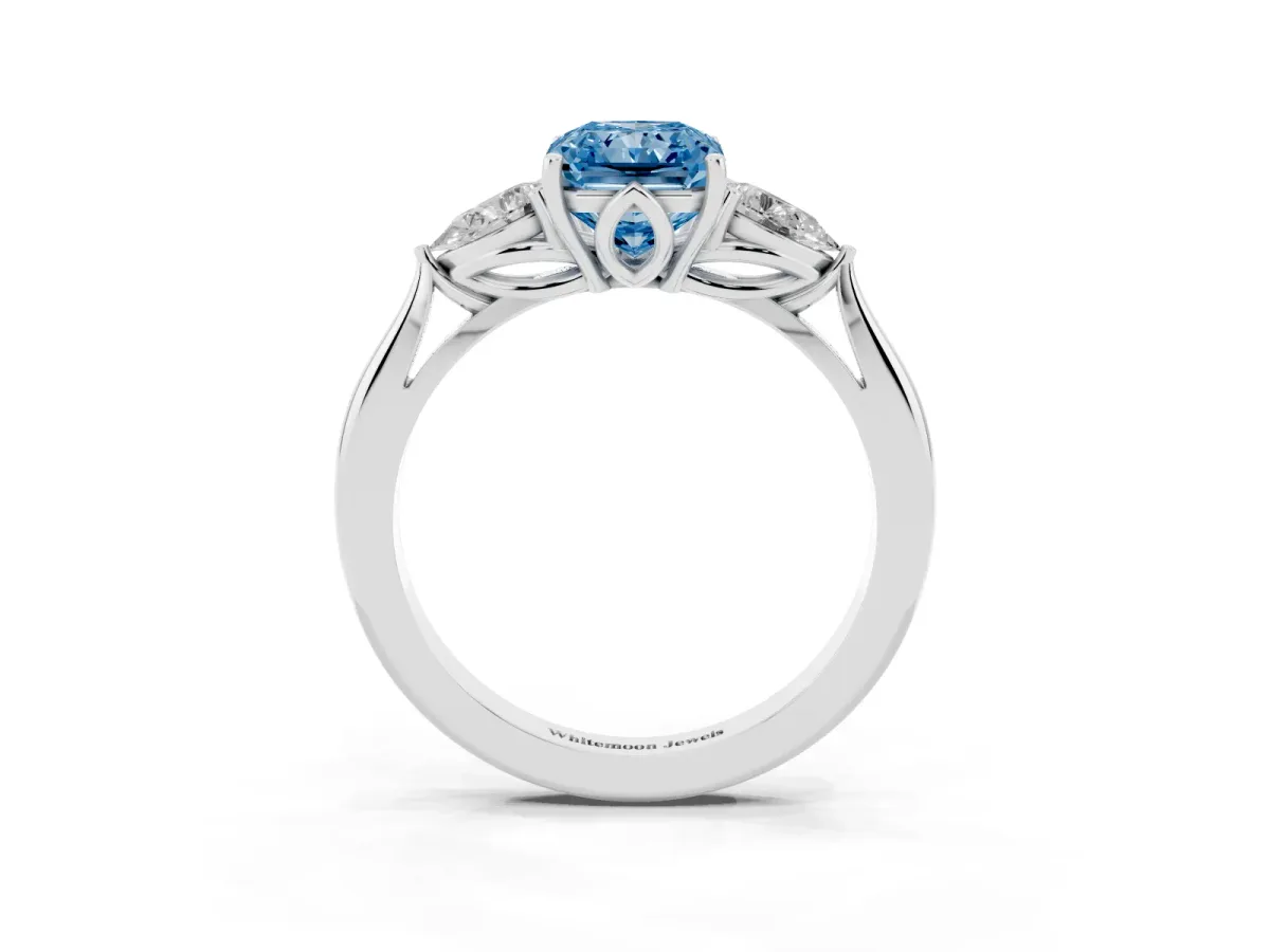 Fancy Blue Three-Stone Radiant Cut Brilliant Diamond Solitaire Ring with Tapered Band and Four-Prong Setting Platinum