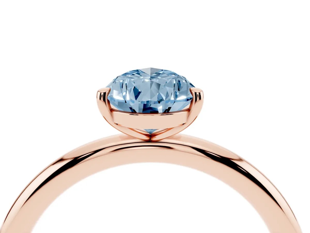 Fancy Blue Pear Cut Solitaire Diamond Ring with Four-Prong Setting on a Plain Band Rose gold