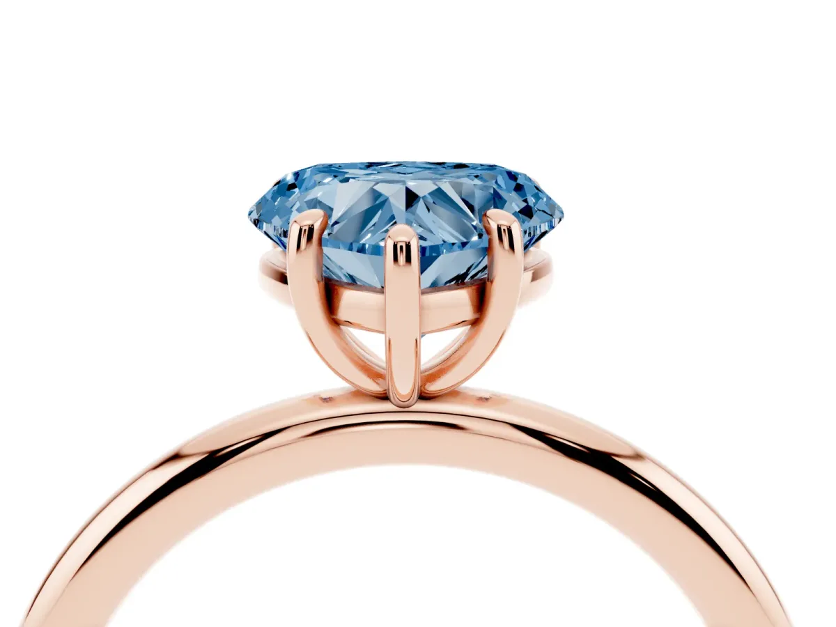 Fancy Blue Heart Cut Solitaire Diamond Ring with Four-Prong Setting on a Plain Band Rose gold
