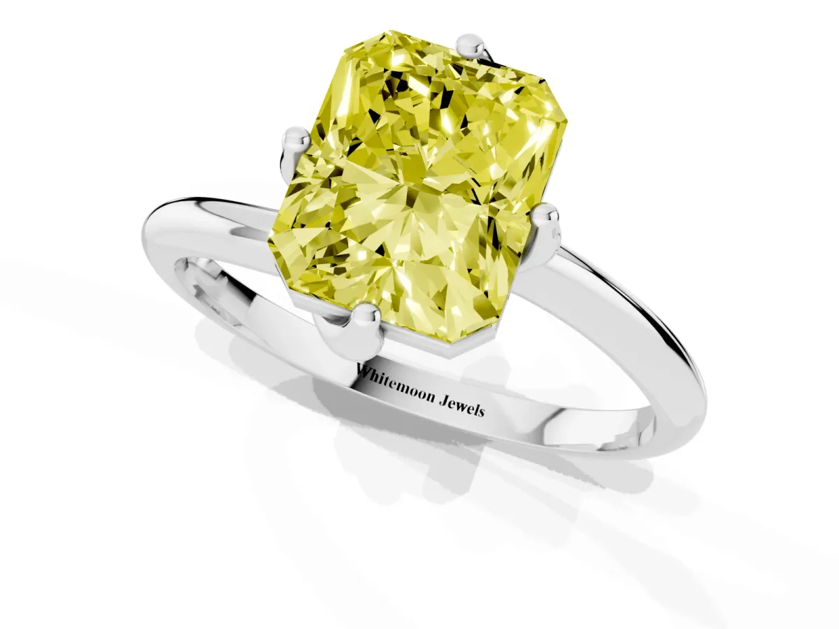 Fancy Yellow Radiant Cut Diamond Solitaire Engagement Ring with Four-Prong Setting and Classic Band Silver