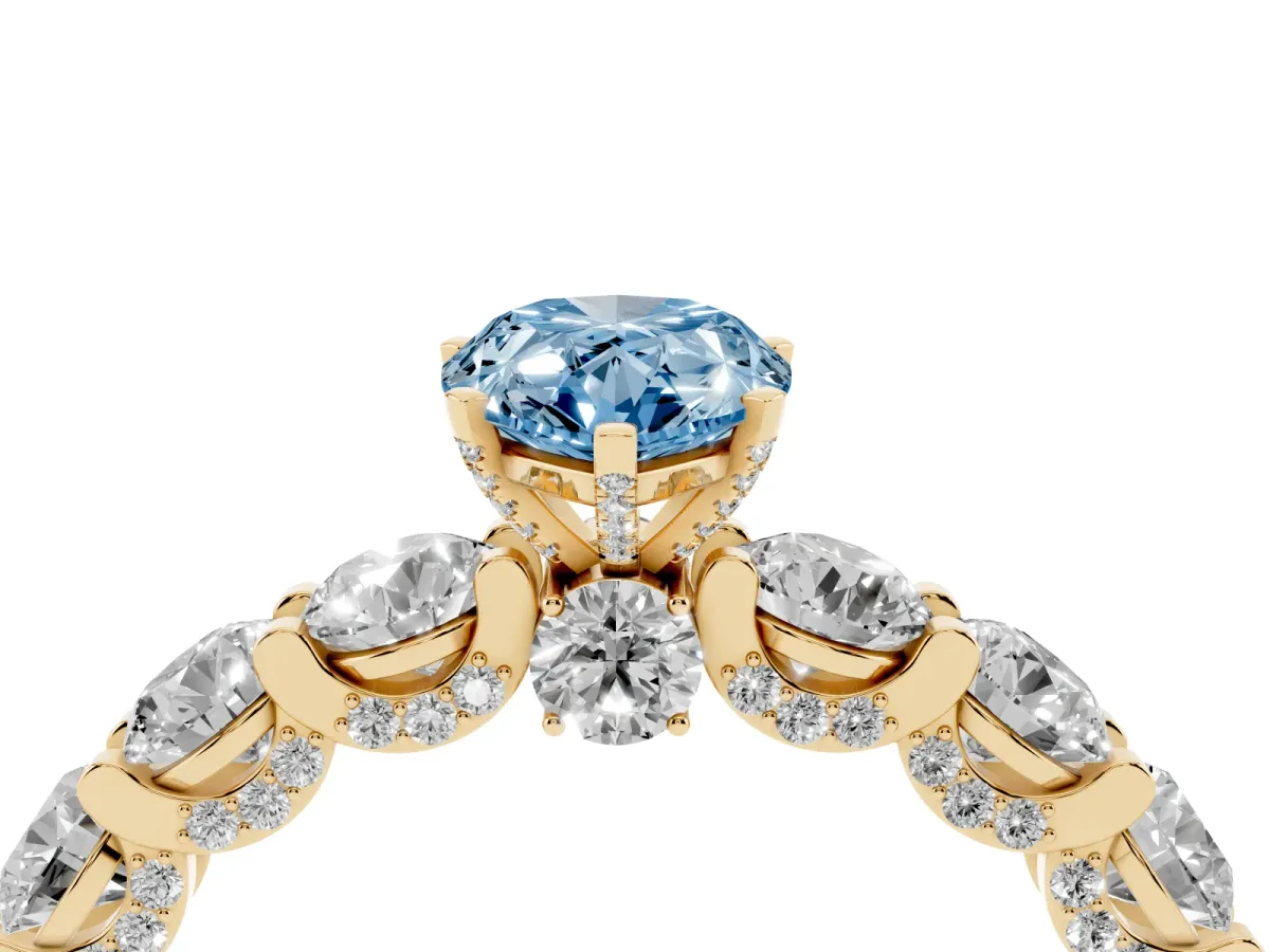 Fancy Blue Pear Cut Diamond Side Stone Engagement Ring with Four-Prong Setting Yellow gold
