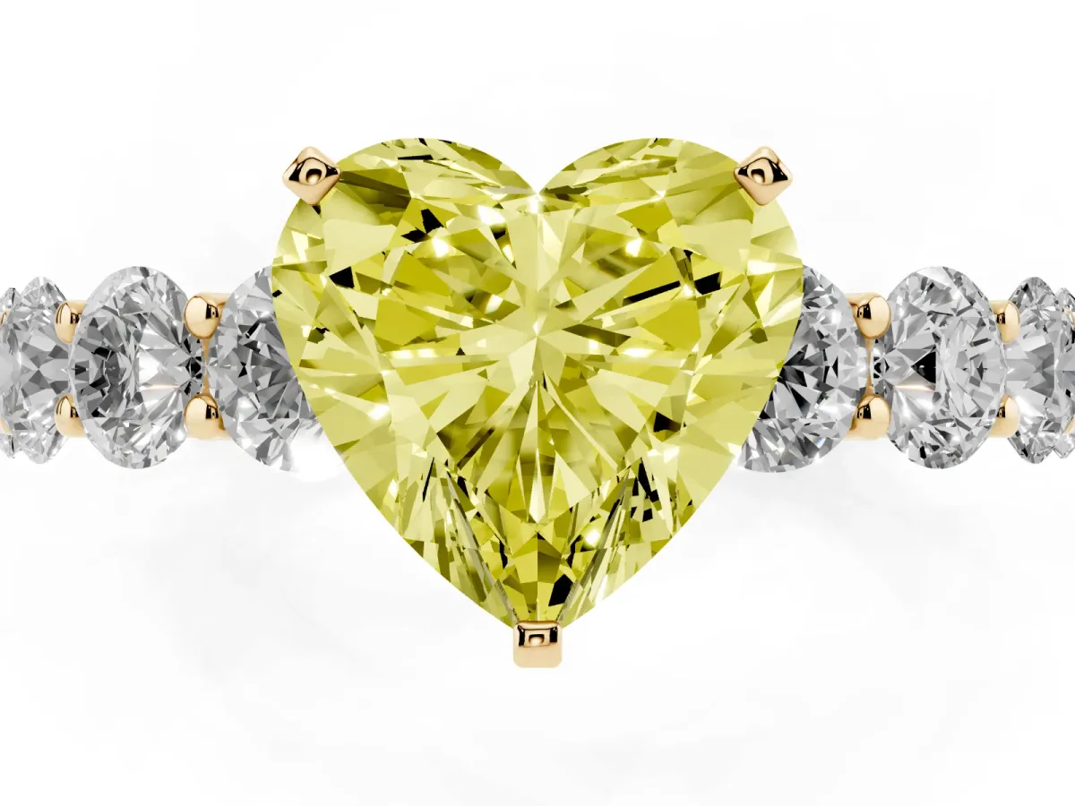 Fancy Yellow Heart Cut Diamond Prong Setting with Side Stones on a Pave Band Yellow gold