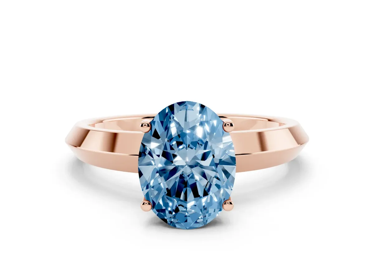 Fancy Blue Oval Cut Cut Solitaire Engagement Ring with Flat Band and Four-Prong Setting Rose gold