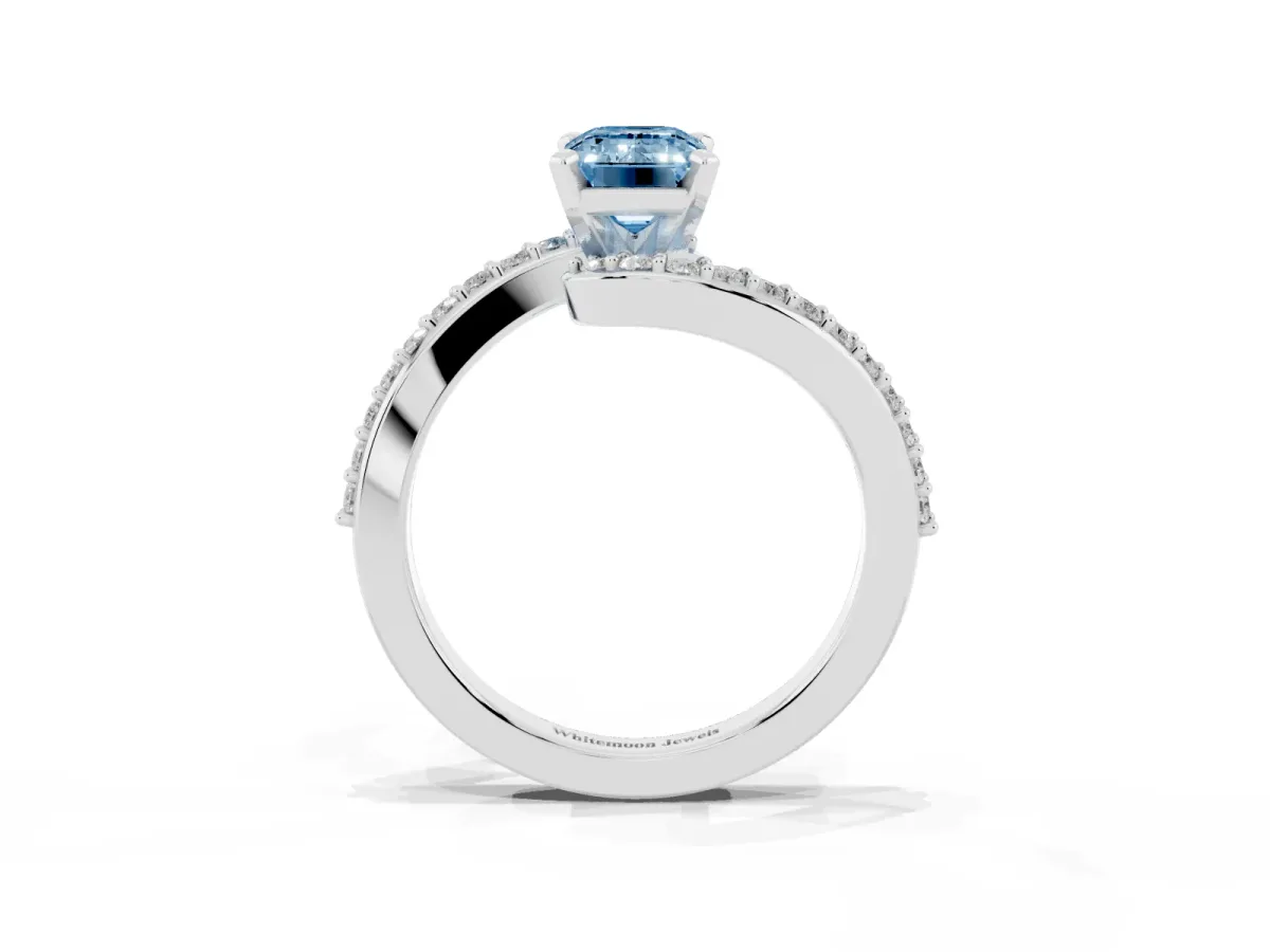 Fancy Blue Emerald Cut Solitaire Twist Band with Pave Set Diamonds and Four-Prong Setting Platinum