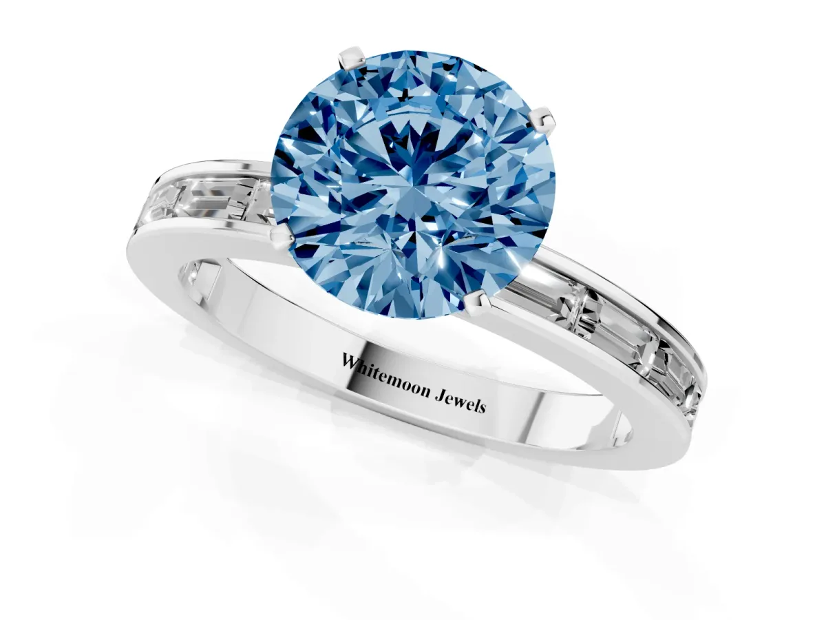 Fancy Blue Round Cut Solitaire Diamond Ring with Channel-Set Baguette Band and Four-Prong Setting White gold