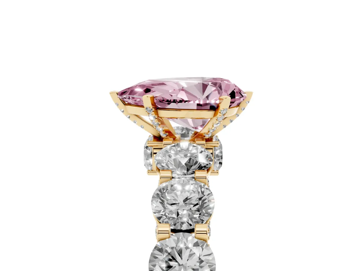 Fancy Pink Pear Cut Diamond Side Stone Engagement Ring with Four-Prong Setting Yellow gold