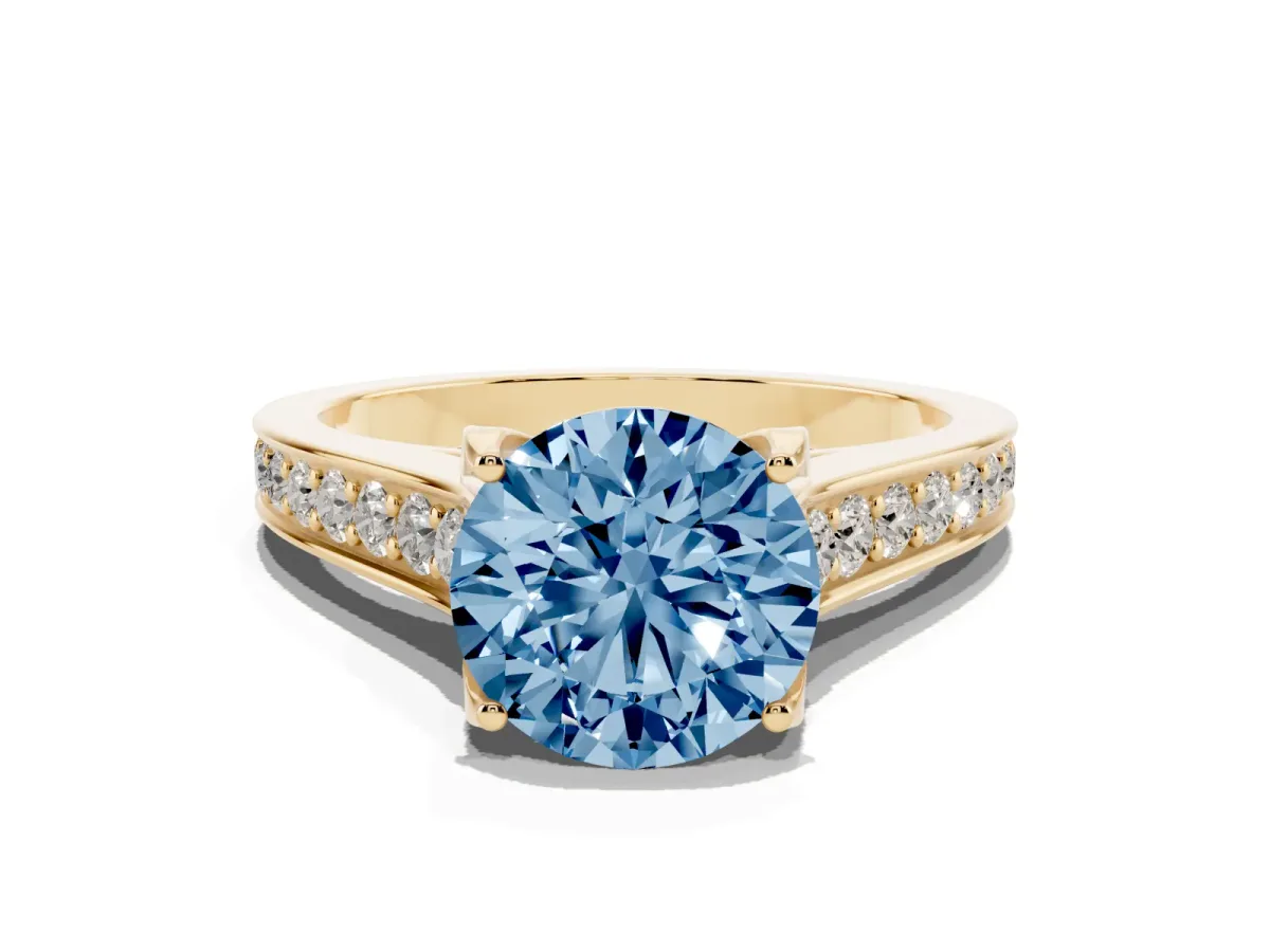 Fancy Blue Round Cut Brilliant Cut Diamond Engagement Ring with Pavé Band and Four-Prong Setting Yellow gold